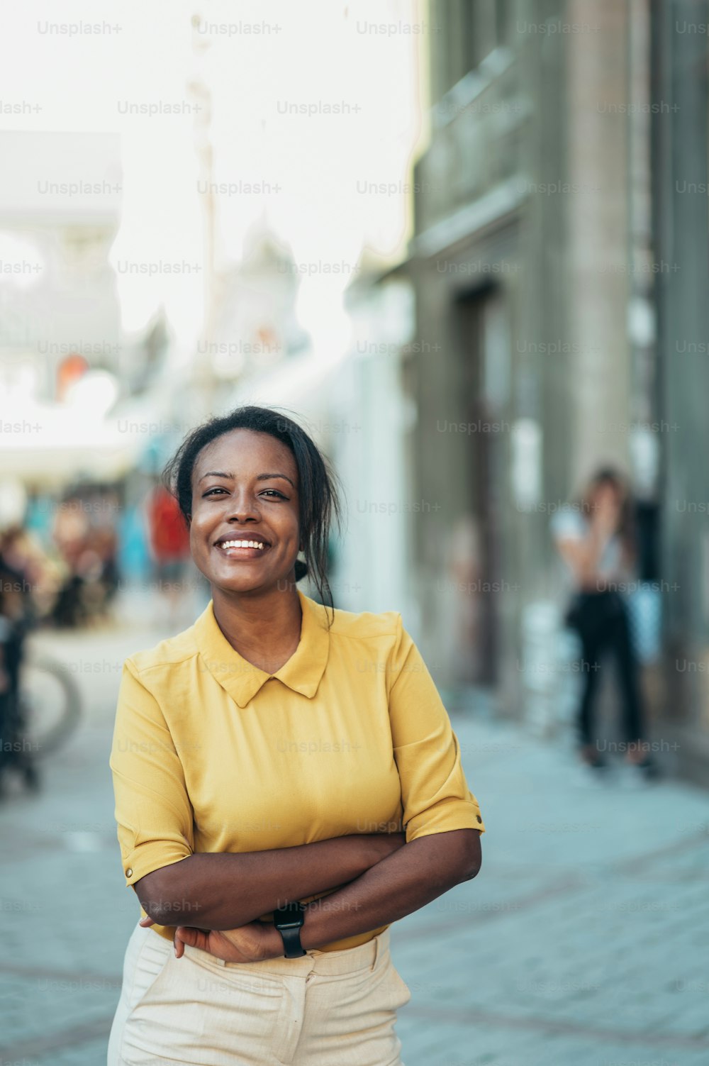 Beautiful young african american woman standing in the city street