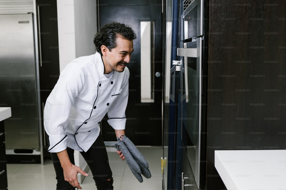 young Latin man baker and baking bread on oven at kitchen in Mexico Latin America