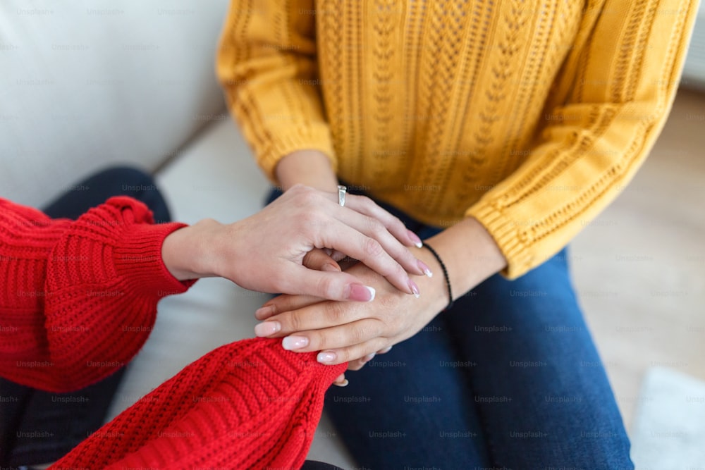 Closeup shot of two unrecognizable people holding hands in comfort. Be the person who helps the next. I'm here for you. Cropped shot of two unrecognizable people holding hands