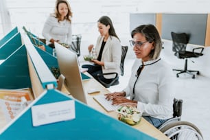 transgender latin woman working with computer at the office in Mexico Latin America