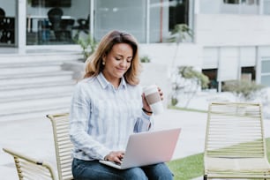 latin business adult woman working with computer at the office in Mexico Latin America