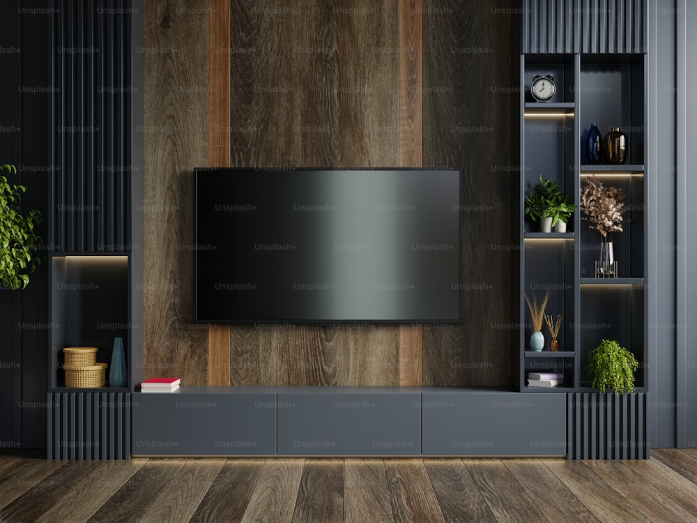 Wooden wall mounted tv in modern living room with decoration on dark wall background.3D rendering