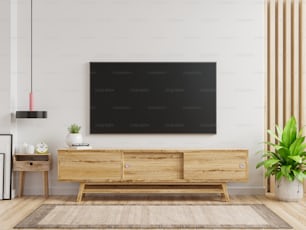 TV LED sur l’armoire dans le salon moderne sur fond de mur blanc, rendu 3d