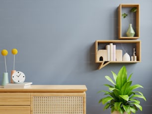 Interior wall mockup with green plant,dark blue wall and shelf.3D rendering