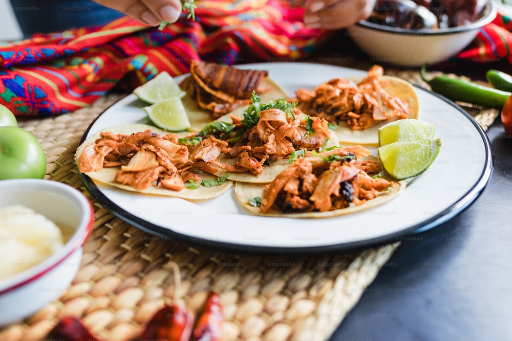 Mexican tacos al pastor with red sauce in Mexico city in Latin America