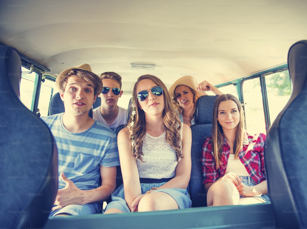 Beautiful young people on a road trip on a summers day