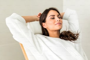 Portrait of a beautiful young  healthy woman relaxing in a robe