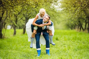 Beautiful young wedding couple outside in nature