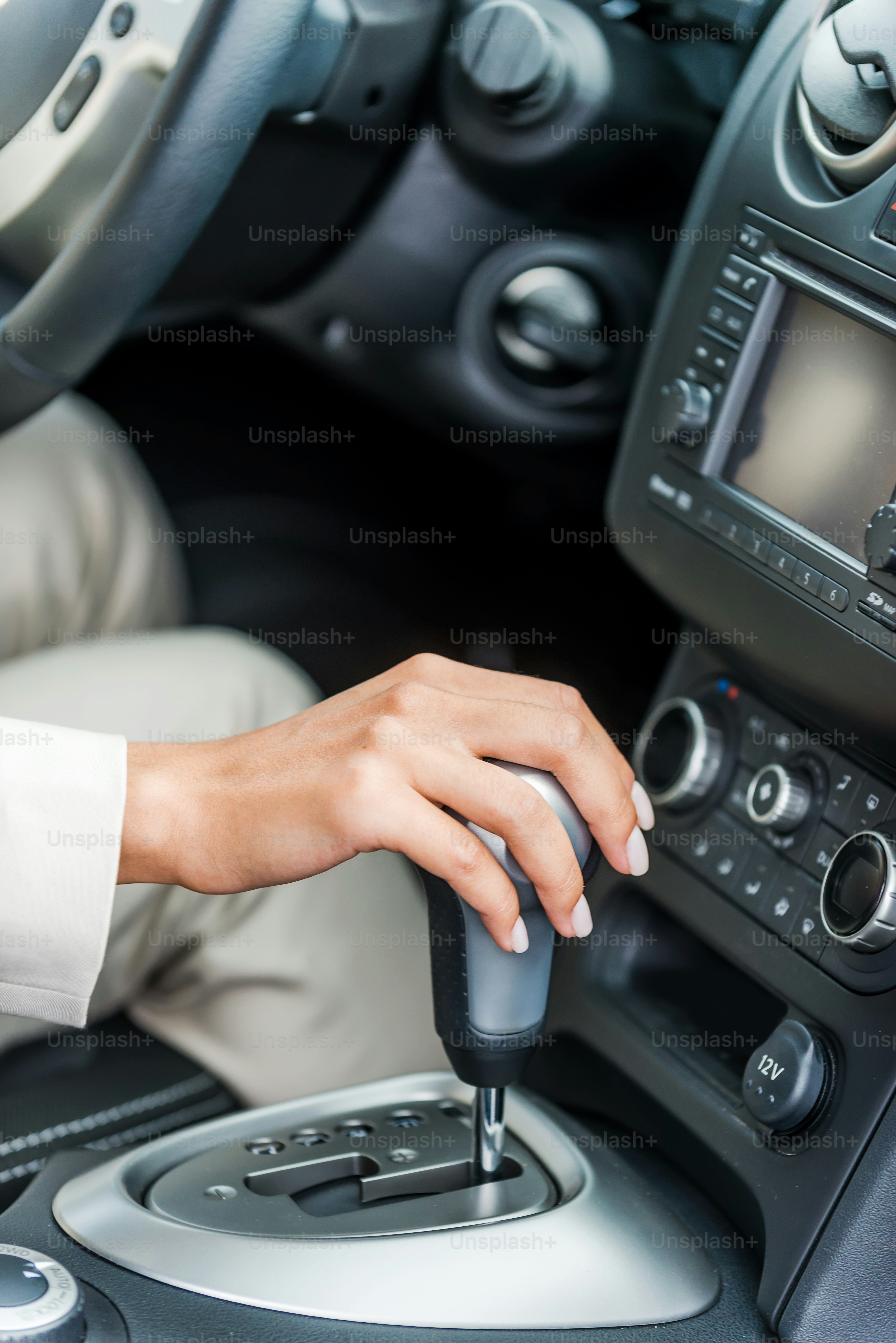 Close-up of woman in formalwear driving car