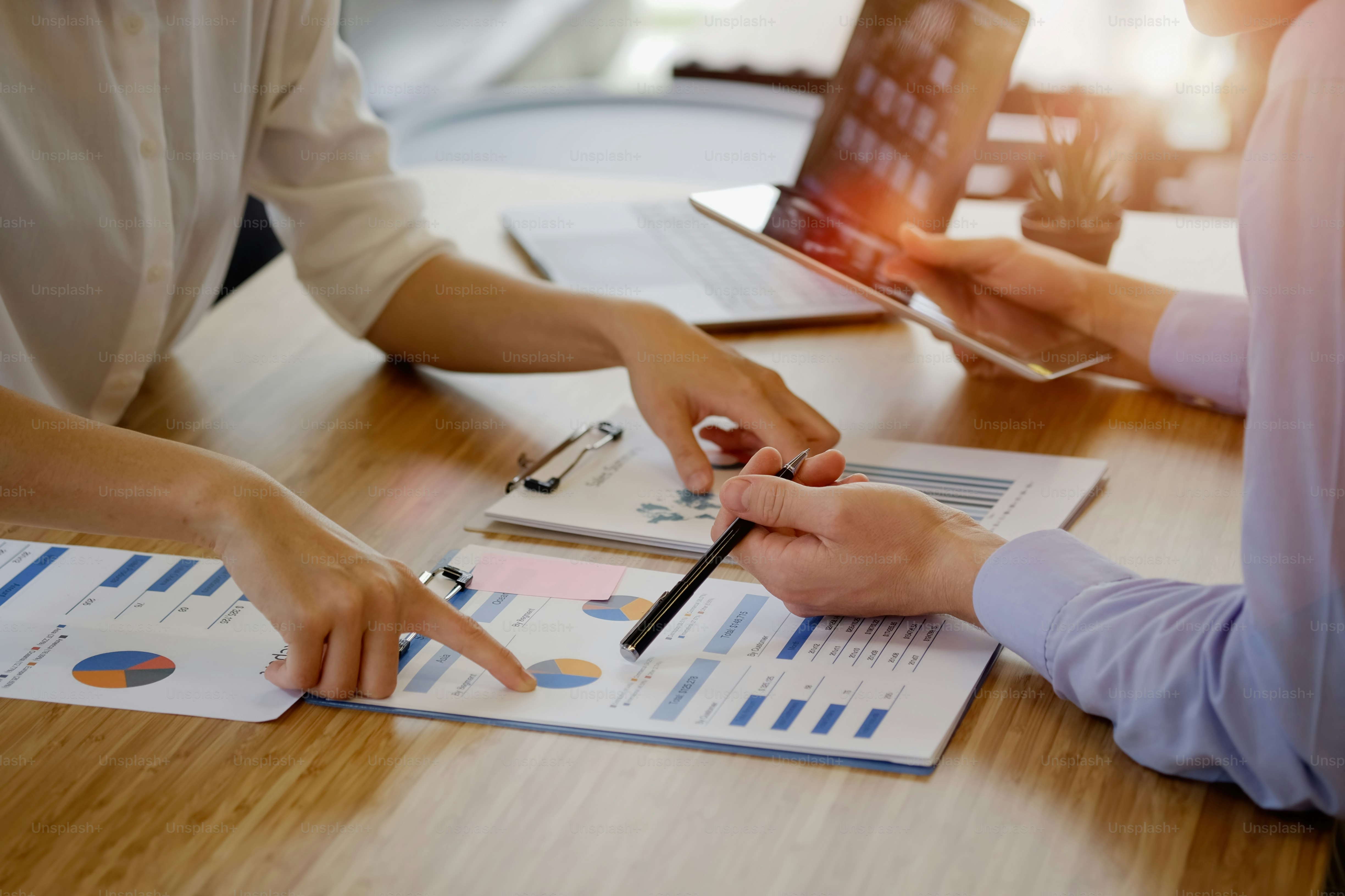Shot of businesspeople working on a laptop in an office