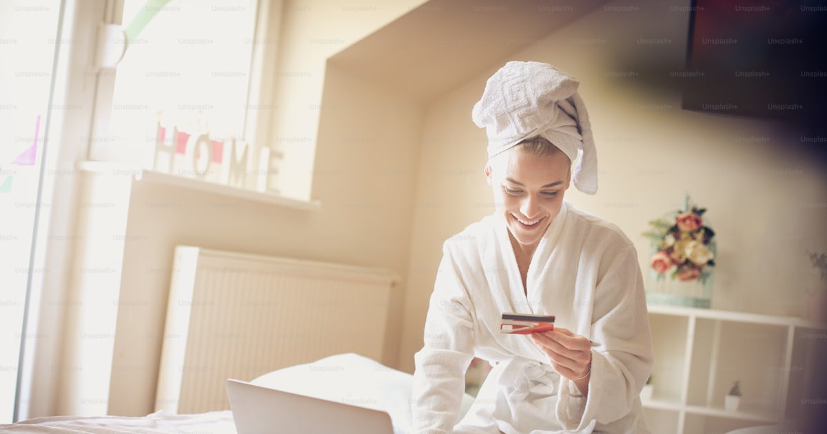 Smiling Woman Checking Credit Card On Laptop Photo Checking Image On smiling-woman-checking-credit-card-on-laptop-photo-checking-image-on