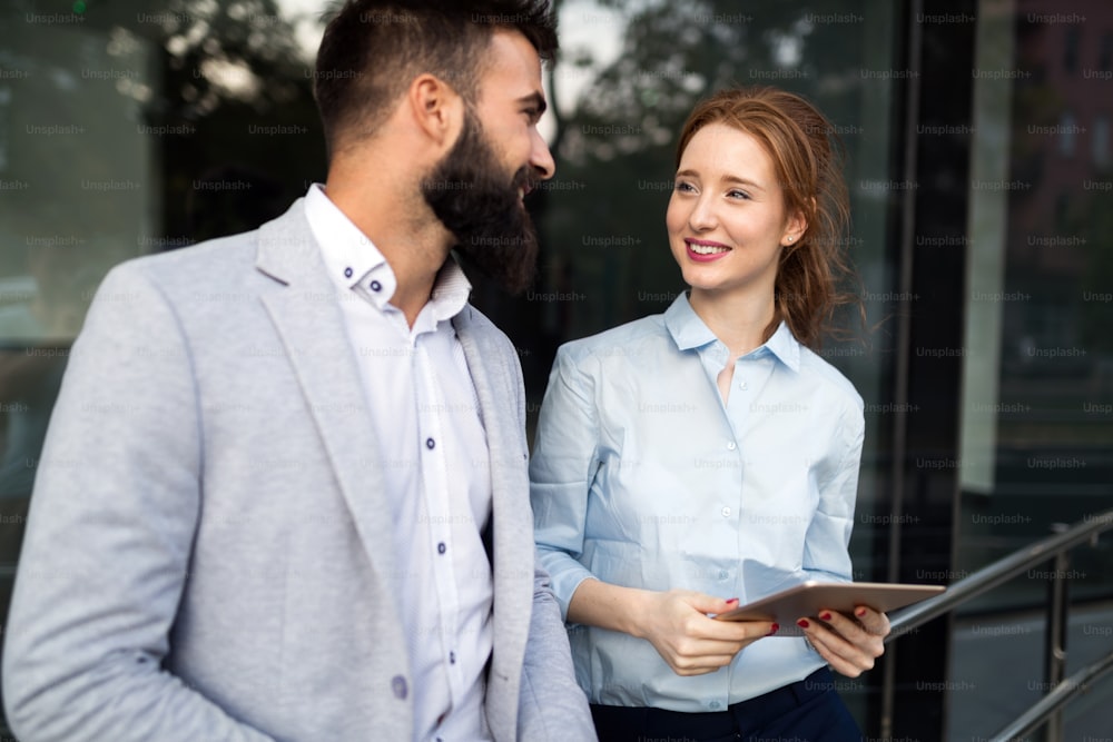 Picture of handsome man and beautiful woman as business partners