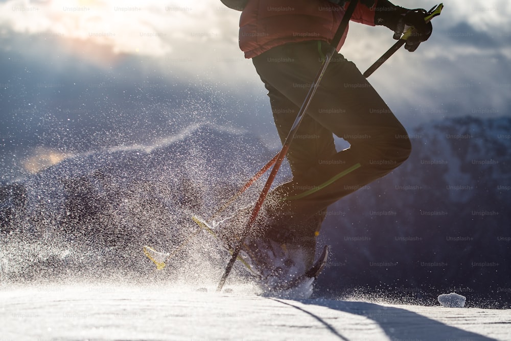 Snow  raised by a man walking with snowshoes. closeup