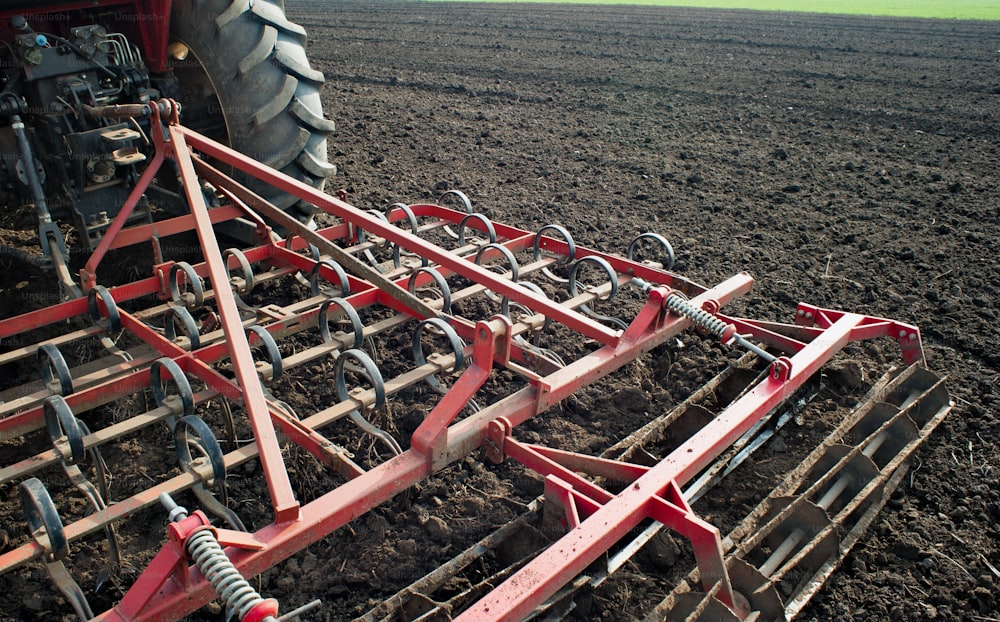 Tractor plowing the fields in spring