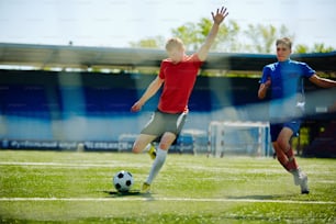 Football player going to shoot the goal