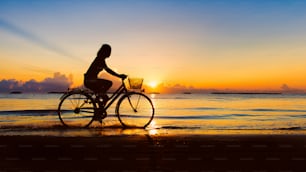 Walking by the sea at dawn a girl aloneWalking by the sea at dawn a girl alone