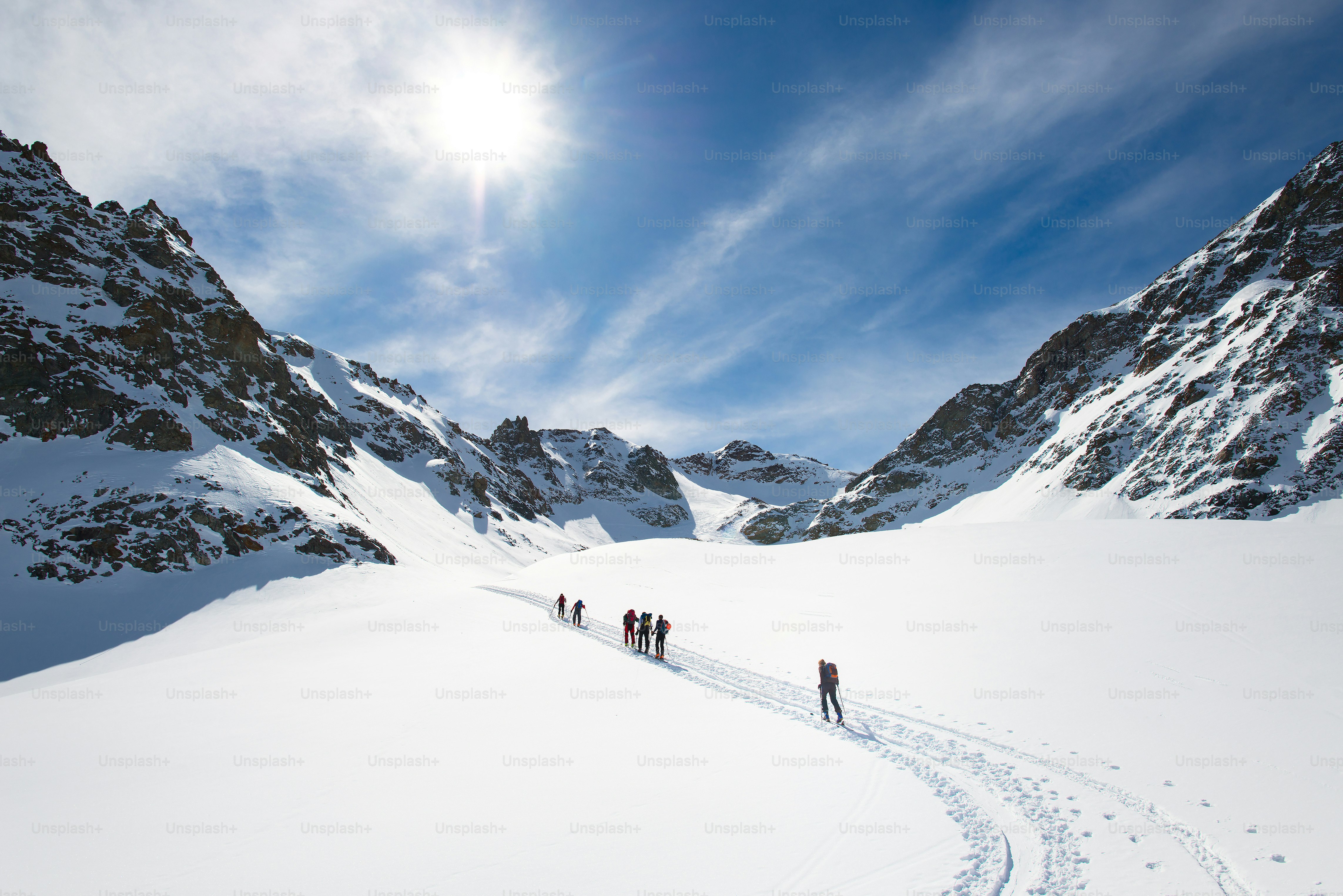 Group of climbers roped to the summit in the winter