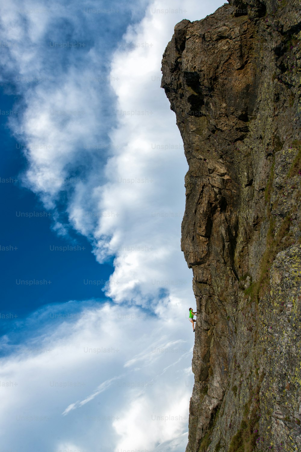 Girl climbing free solo.