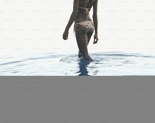 a woman in a bikini standing in the water