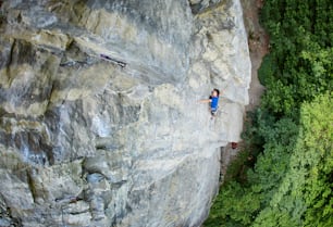 male rock climber. rock climber climbs on a rocky wall.