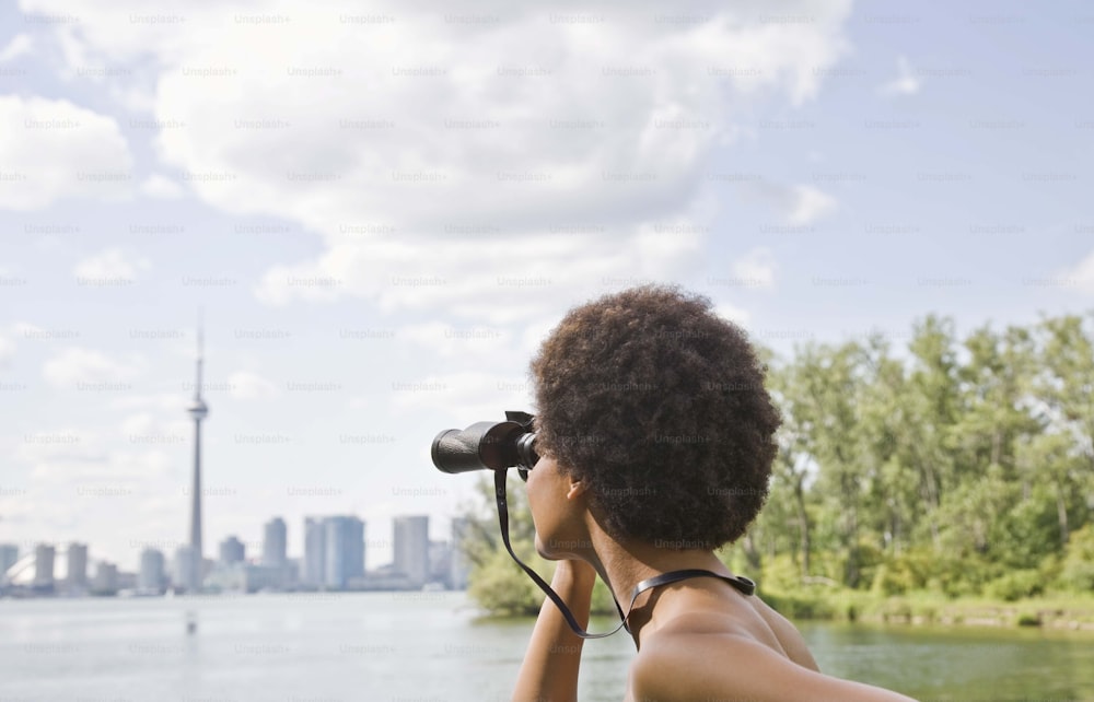 a woman looking through a pair of binoculars