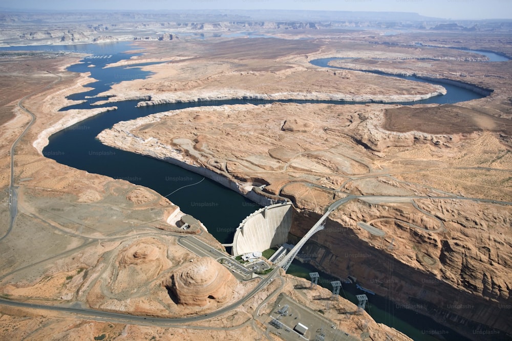 an aerial view of a dam in the middle of the desert