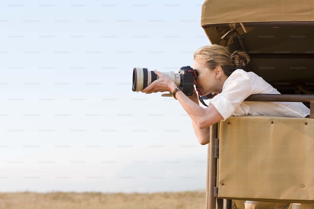 a woman is taking a picture of herself in the back of a truck