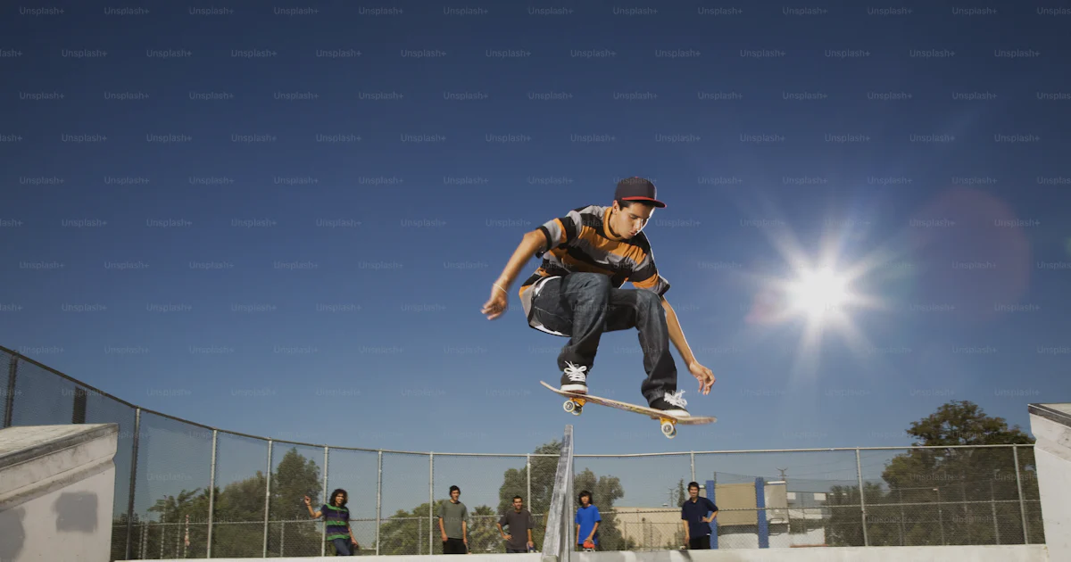 Skateboard Rails Ride Up A man riding a skateboard up the side of a metal rail photo – Adventure ...