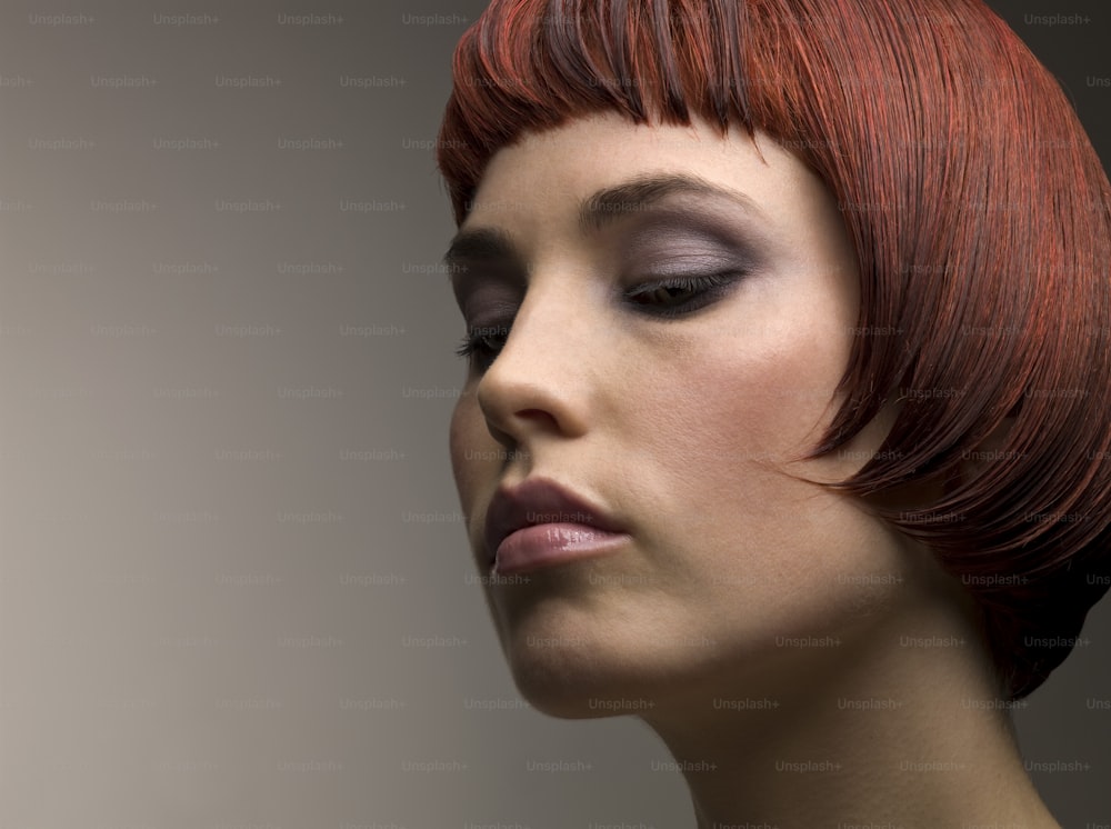 a woman with red hair and a black dress