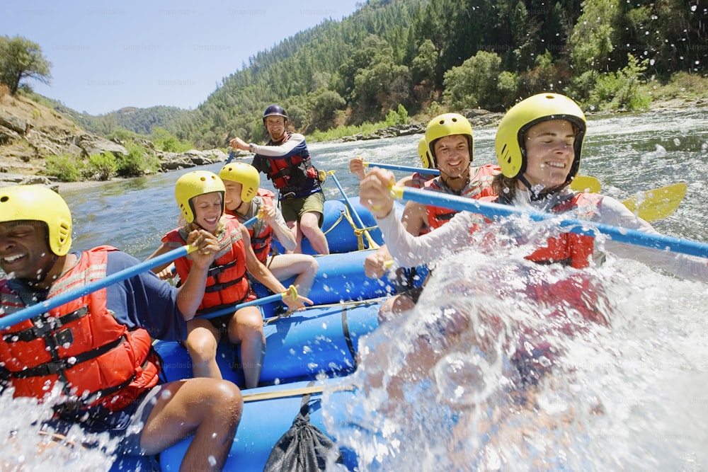 a group of people are rafting down a river