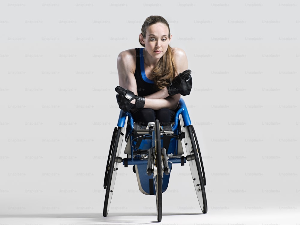 a woman in a wheelchair posing for a picture