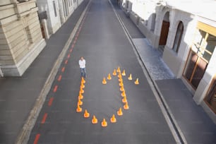 a man standing in the middle of an empty street