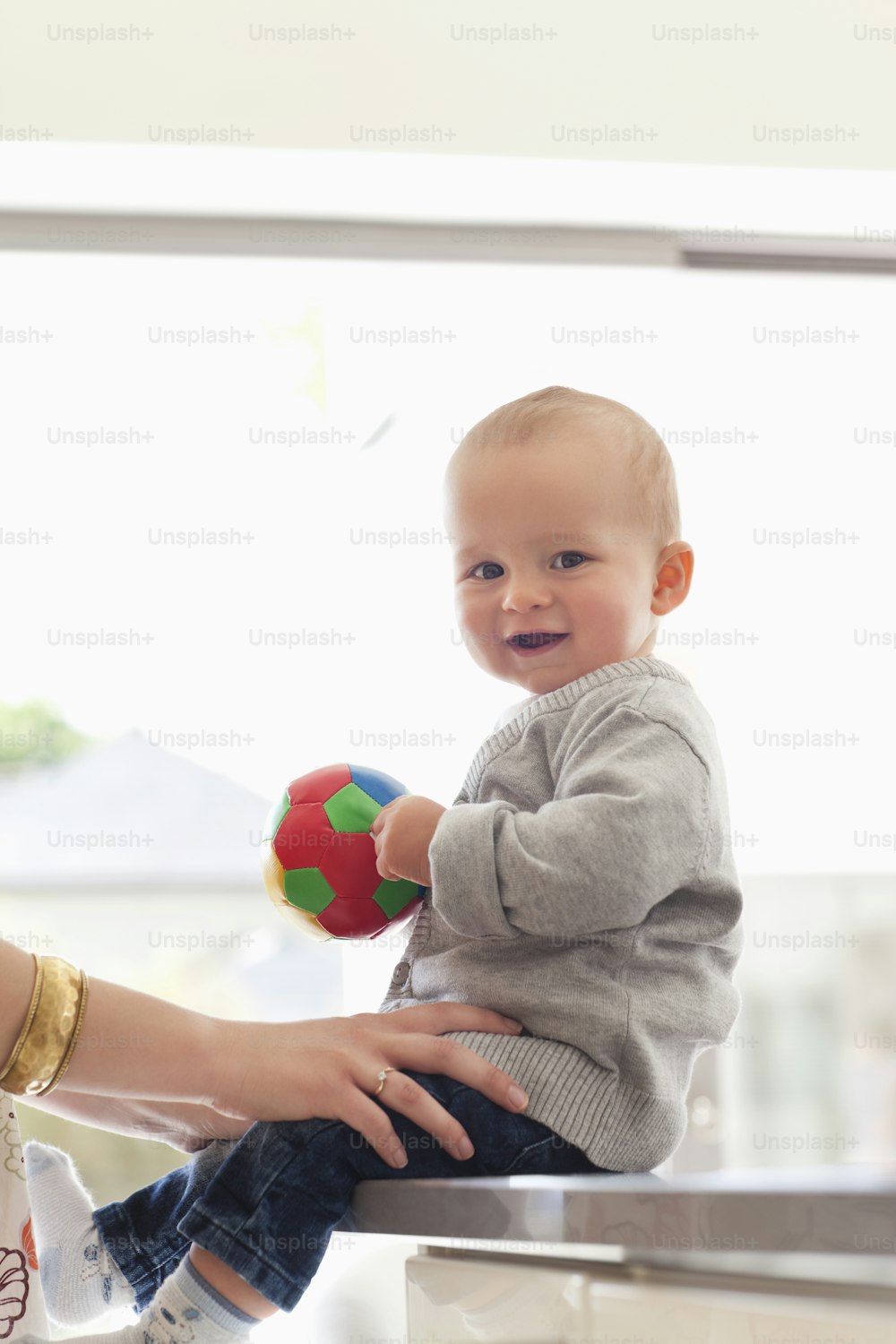 a woman holding a baby in her lap