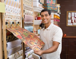 a man holding an umbrella in a store