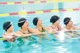 a group of women swimming in a pool