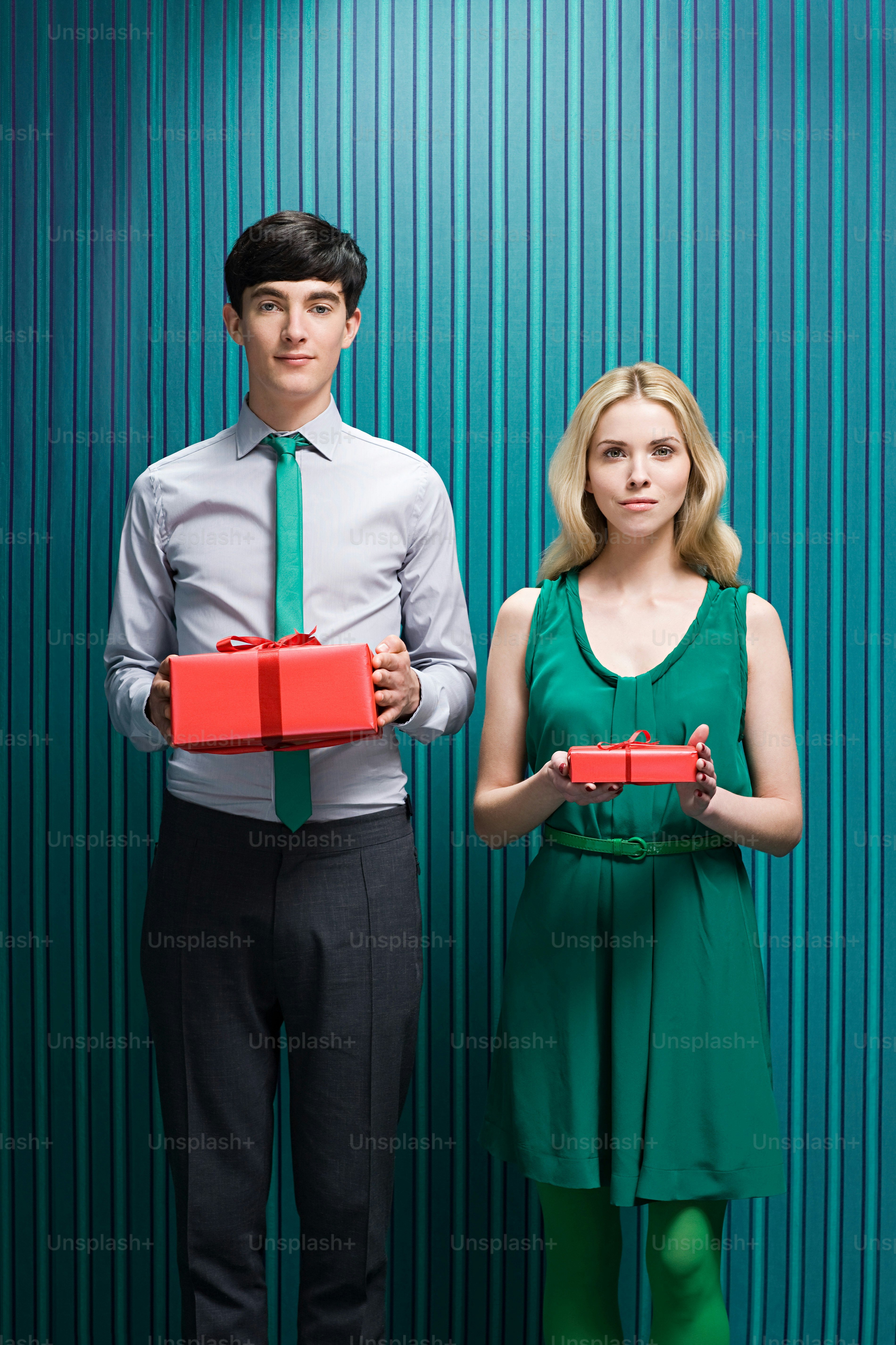 A man and a woman standing next to each other photo – Fashion Image on ...