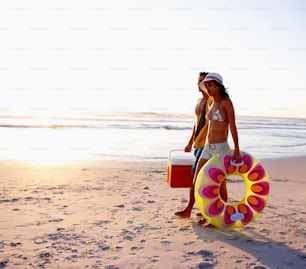 Happy young couple enjoying their vacation at the beach