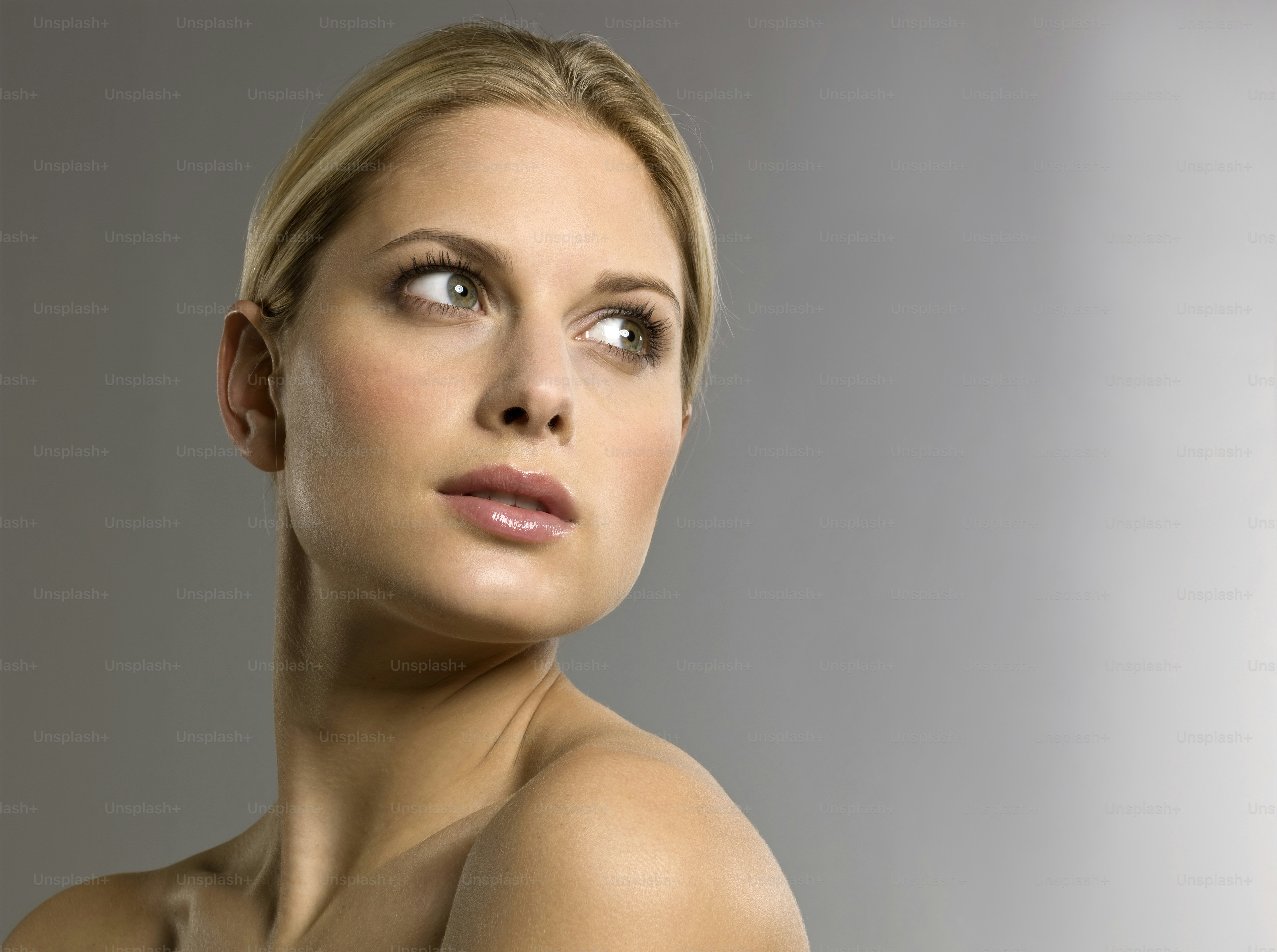 a beautiful blond woman posing for a picture