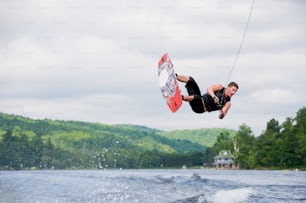 a man on a wake board in the air