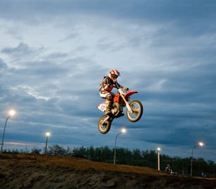 a person on a dirt bike jumping in the air