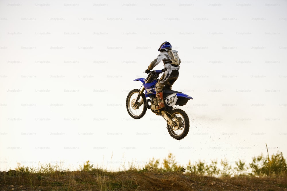 a person on a dirt bike in the air