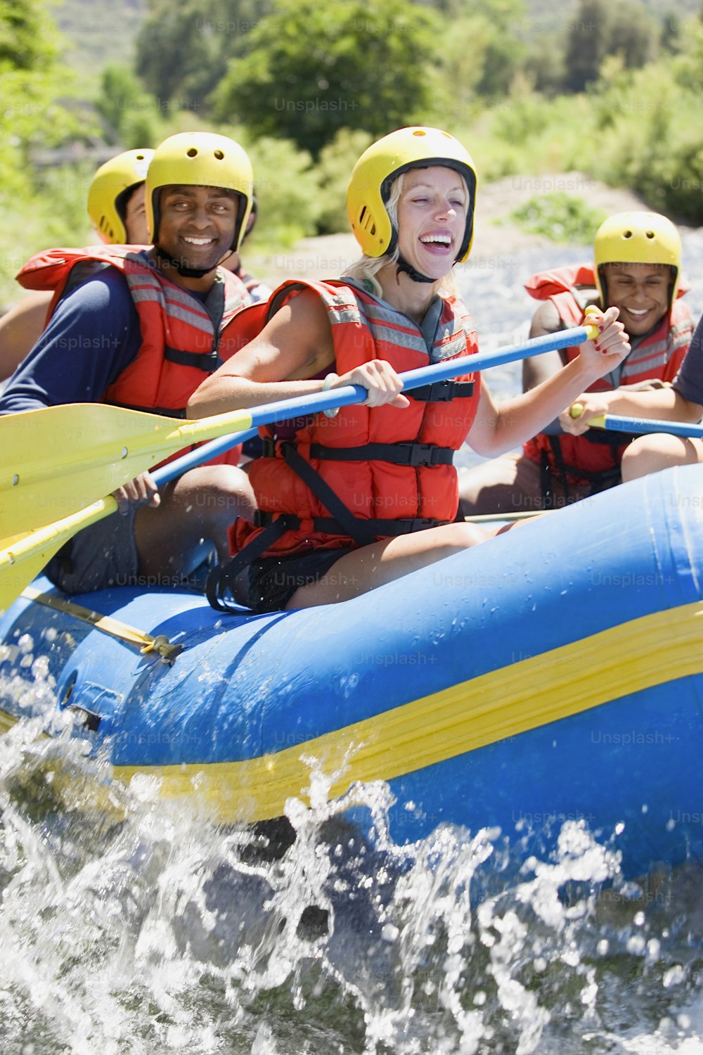 a group of people riding on the back of a raft