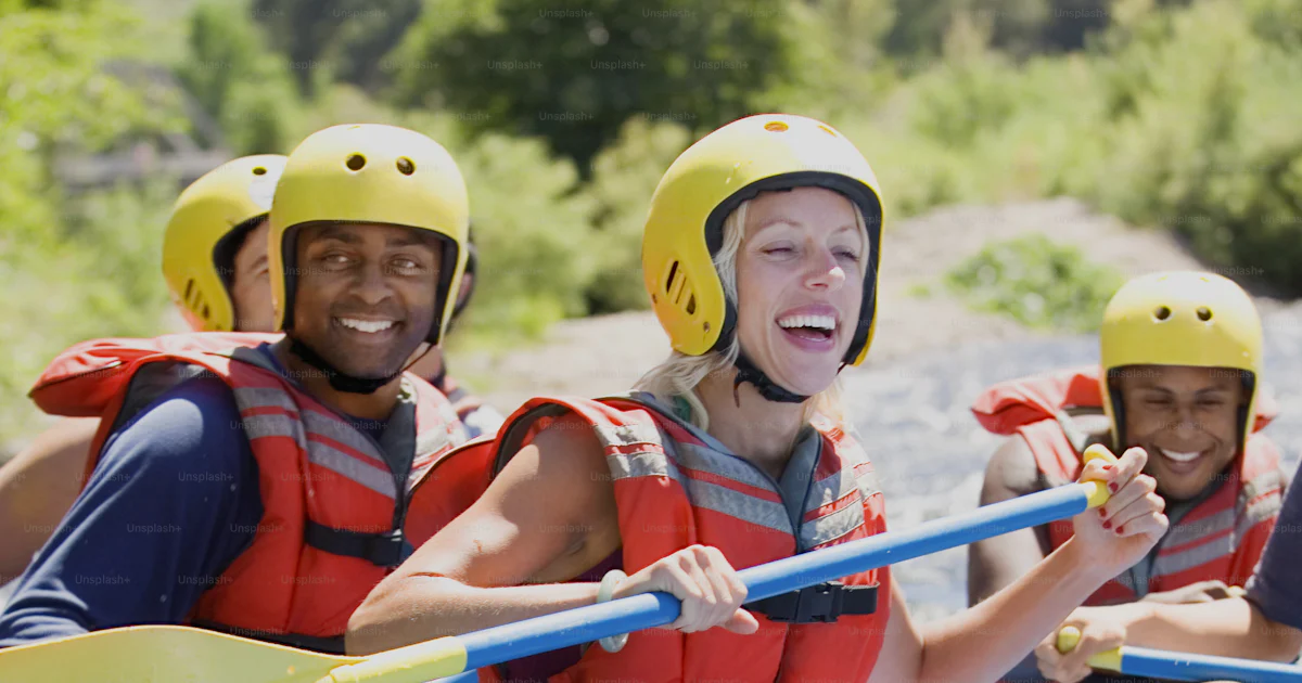 Person Riding Raft A group of people riding on the back of a raft photo – People Image on ...