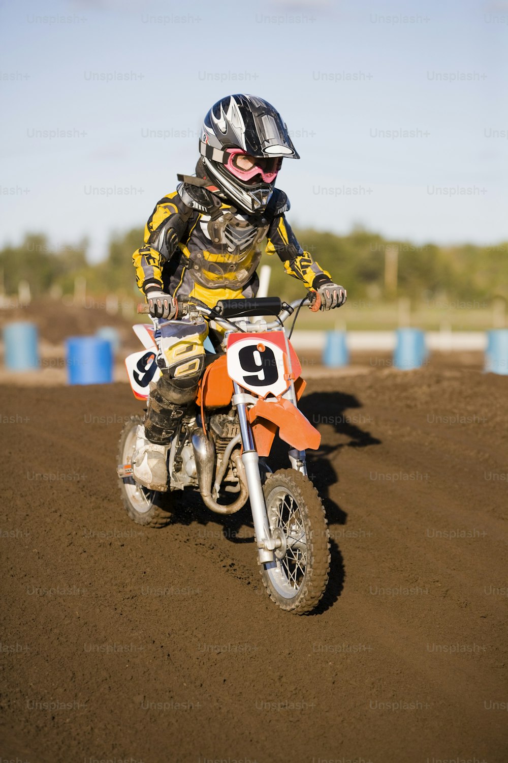 a person riding a dirt bike on a dirt track