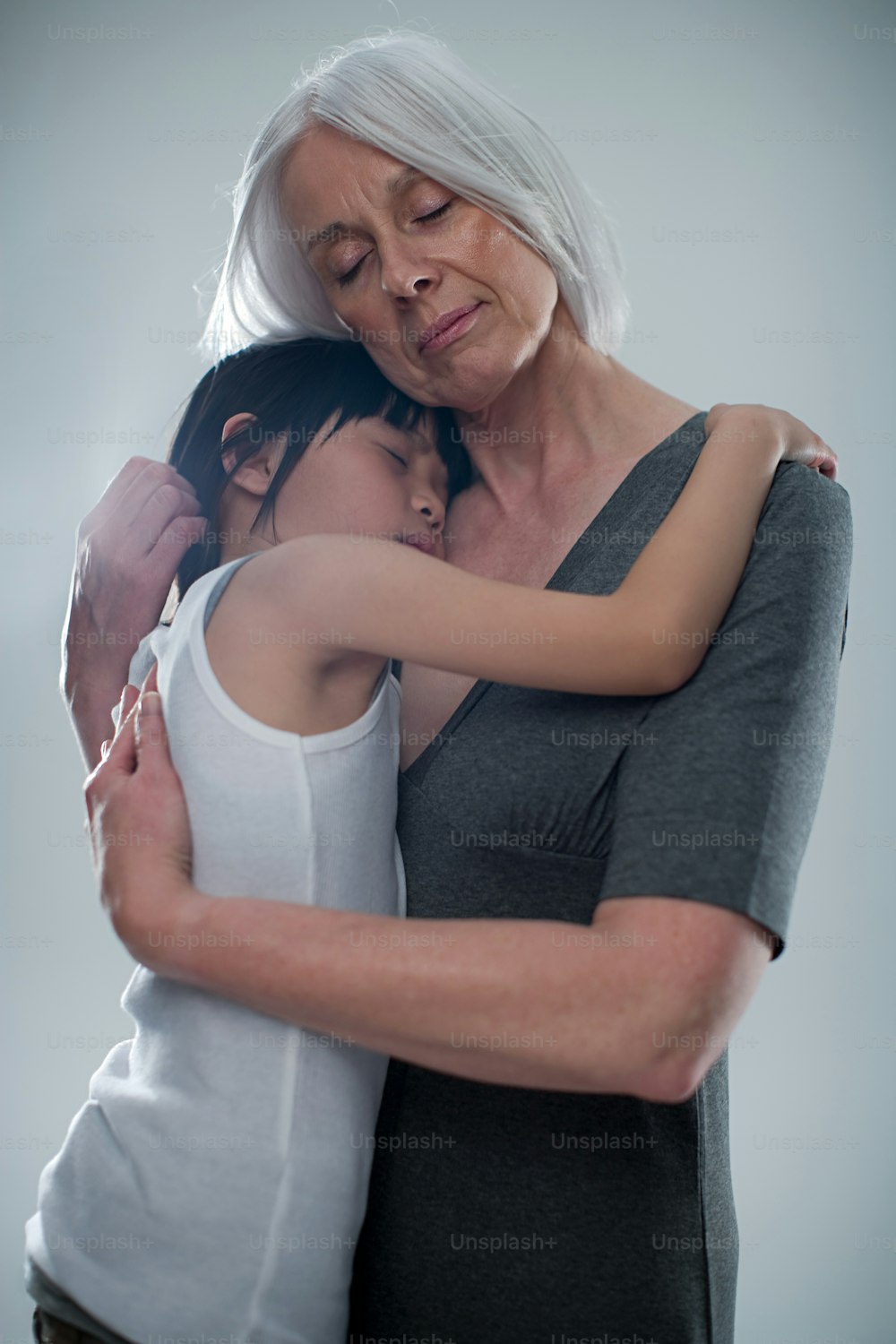 an older woman hugging a younger woman