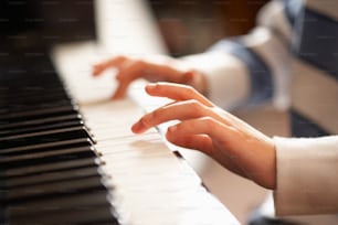 a close up of a person playing a piano