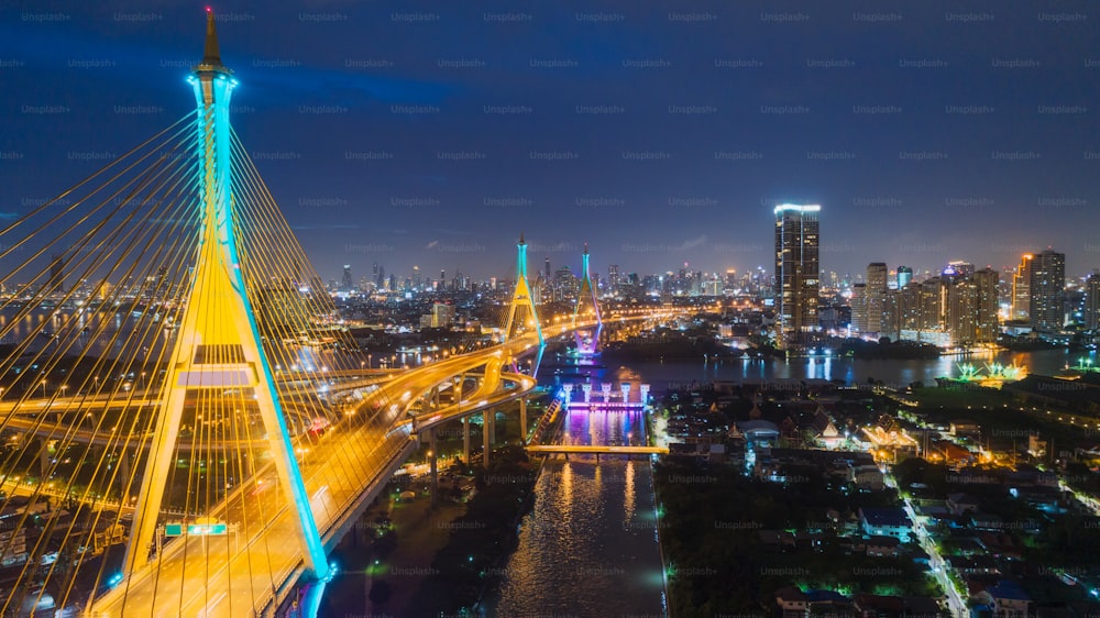 Aerial view network or intersection of highway road with cityscape background for transportation or distribution concept.