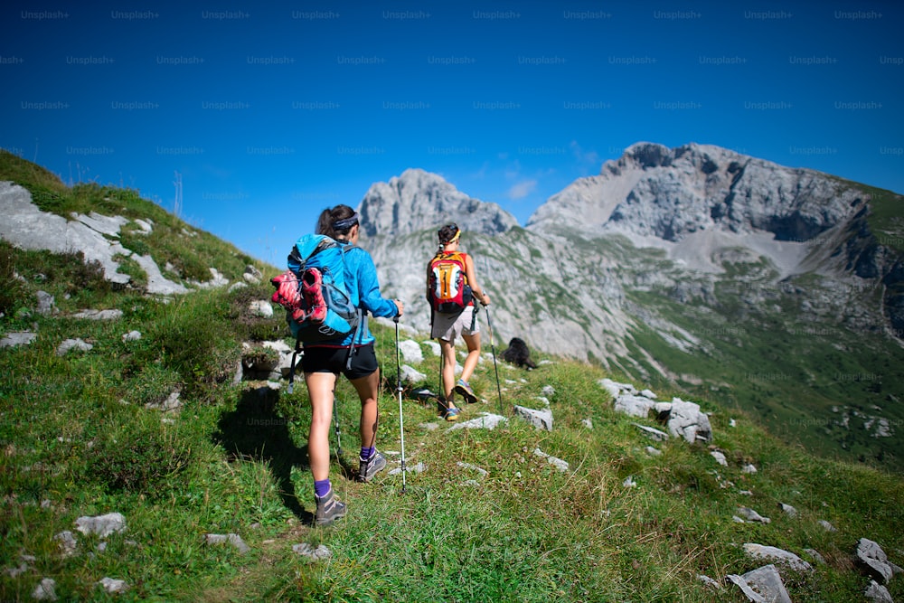 Trekking of two coworkers working in the mountains on a day off.