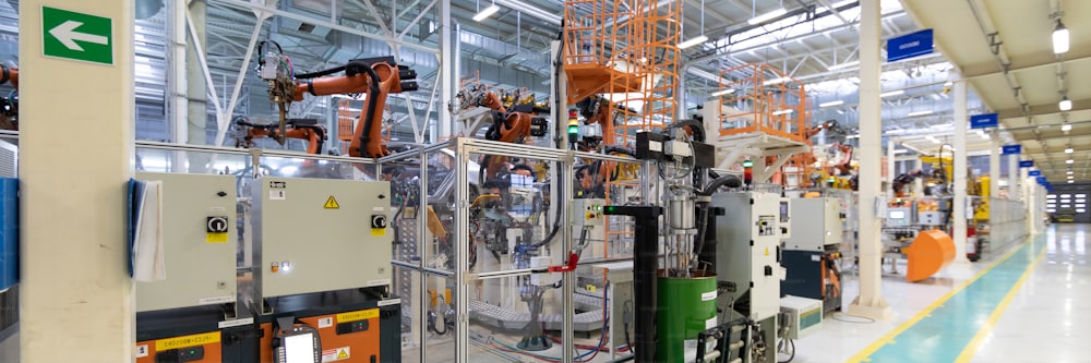 Robotic equipment collects cars on the production line. Long format shooting automotive. Car factory banner
