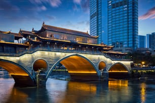 Famous landmark of Chengdu - Anshun bridge over Jin River illuminated at night, Chengdue, Sichuan , China